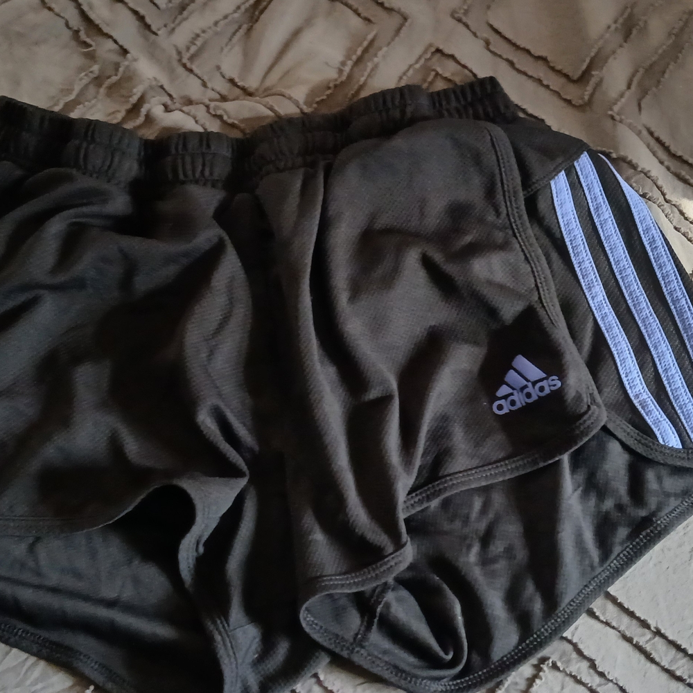 Adidas Black Athletic Shorts with White Stripes.
